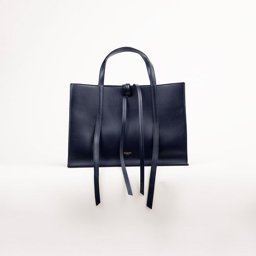 Blue Black handbag with straps on a white background